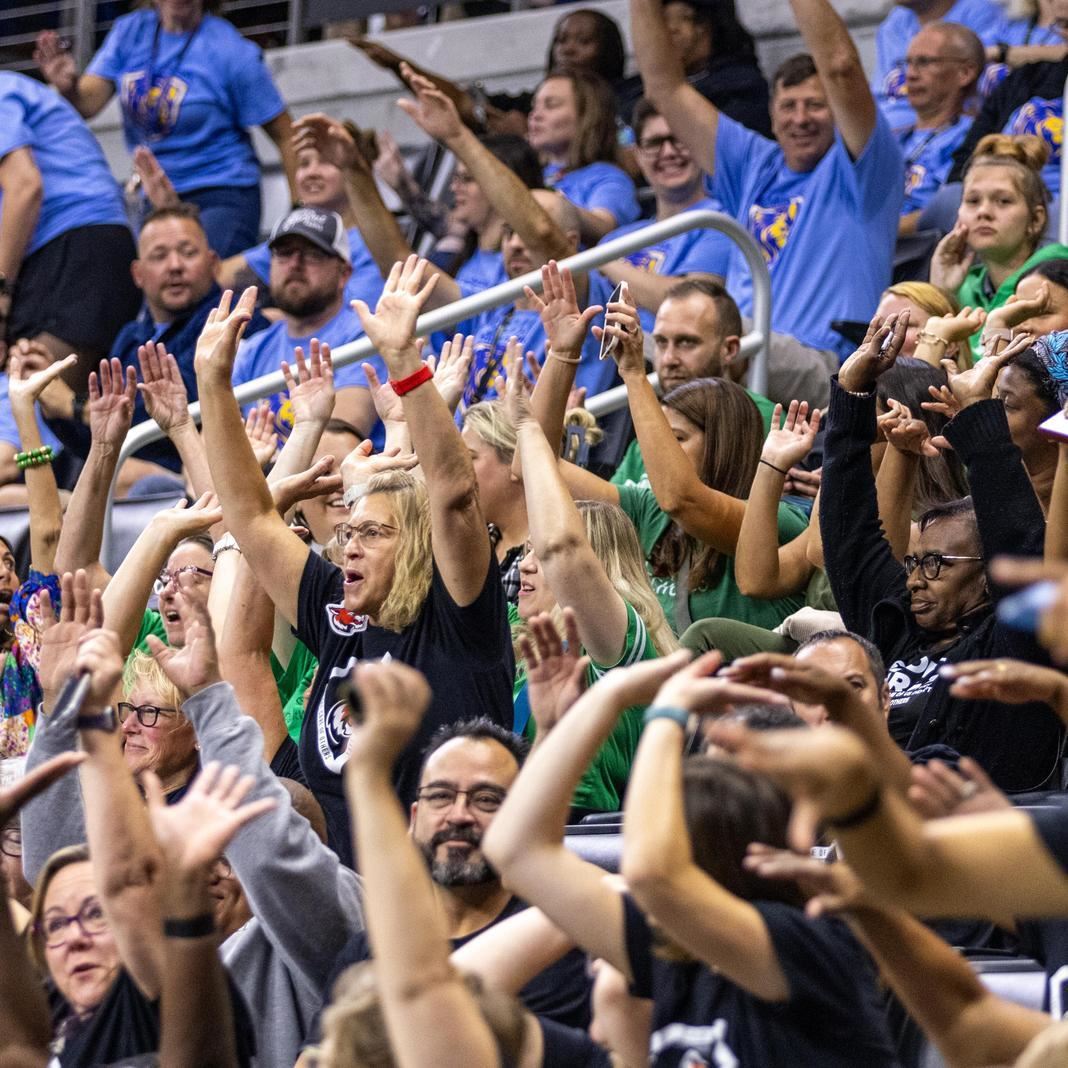  Staff cheer at the annual kickoff meeting